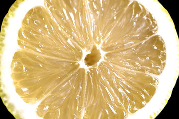 Slice of lemon close up. Isolated