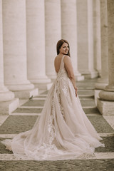 Obraz premium Pretty young bride in wedding dress in the Vatican