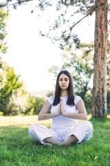Fototapeta premium Beautiful girl doing meditation
