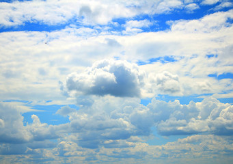 blue sky and heavy, white clouds