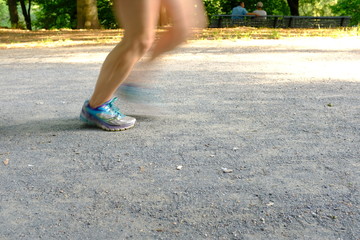 A jogger in a park in Berlin-Germany on a warm and sunny day.