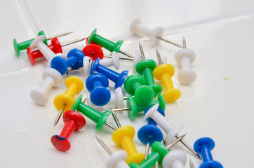 The clerical buttons that are stuck in the wall,