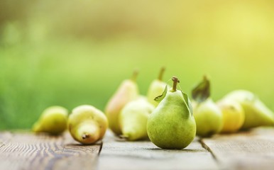 Pear fruit isolated on wooden table. Pears background