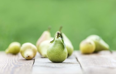 Pear fruit isolated on wooden table. Pears background