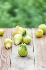 Pear fruit isolated on wooden table. Pears background