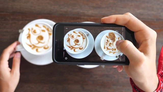 Woman Hands Taking Pictures Of Coffee With Smartphone In Cafe