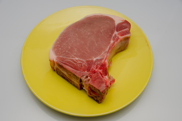 meat lies on a plate, appetizing meat for cooking