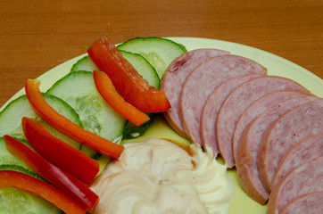 sliced vegetables and sausages