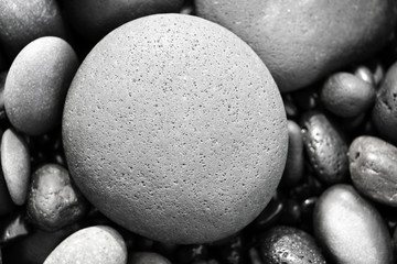 round stone on a grey stones background