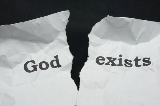 Atheism. Torn sheet of paper with the inscription.
