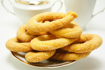 Breakfast. Sweet cookies on a background of dishes.