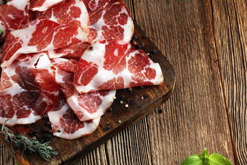 Italian sliced cured coppa with spices. Raw ham. Crudo or jamon