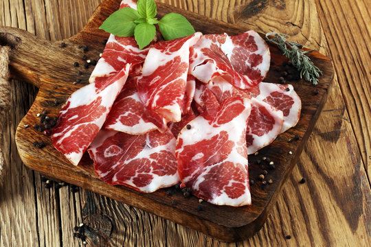 Italian sliced cured coppa with spices. Raw ham. Crudo or jamon