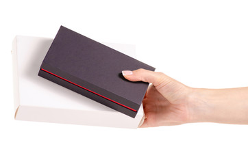 Black and white boxes in hands on white background isolation