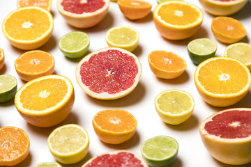 Citrus fruit background. Slices of grapefruit, orange, lemon and lime