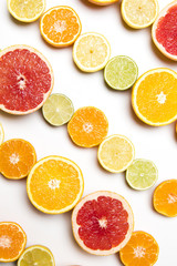 Citrus fruit background. Slices of grapefruit, orange, lemon and lime
