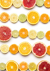 Citrus fruit background. Slices of grapefruit, orange, lemon and lime