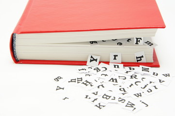 Letters falling from the middle of the book.