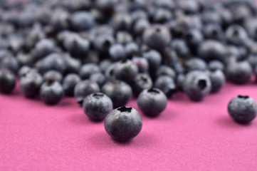 Fresh blueberries close-up stock photo images. Blueberries on a purple background. Healthy summer fruit