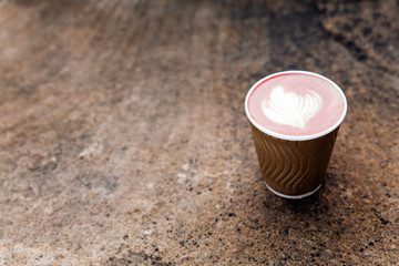 Cup of cuppuccino on stone textured background