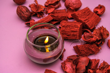 Beautiful burning candle on wooden background
