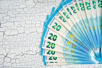  Euro cash background. pile of paper euro banknotes as part of the united country's payment system  . cracked background