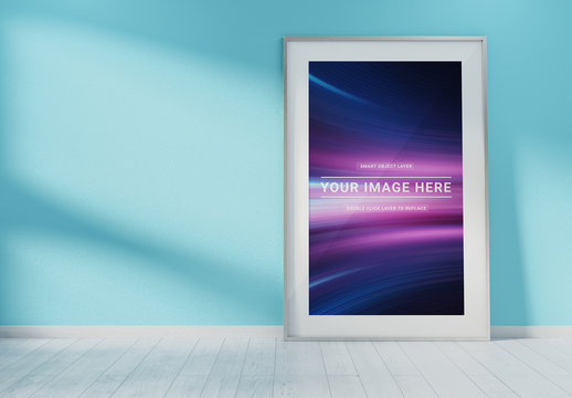 White Vertical Frame against a Blue Wall Mockup