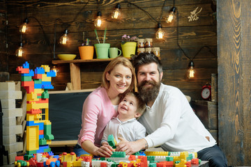 Playschool concept. Playschool kid play with mother and father. Happy family in playschool. Playschool education and child care