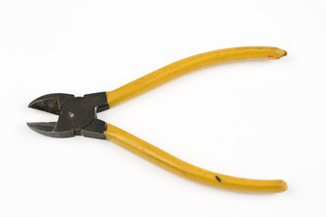 Pliers and cable cutters on a white table. Accessories for DIY enthusiasts and electricians.