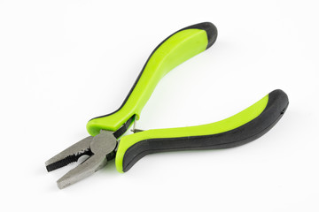 Pliers and cable cutters on a white table. Accessories for DIY enthusiasts and electricians.