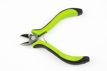Pliers and cable cutters on a white table. Accessories for DIY enthusiasts and electricians.