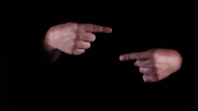Hand Gestures coming out of the dark into the light. Holding GFX object. Confused with directions.