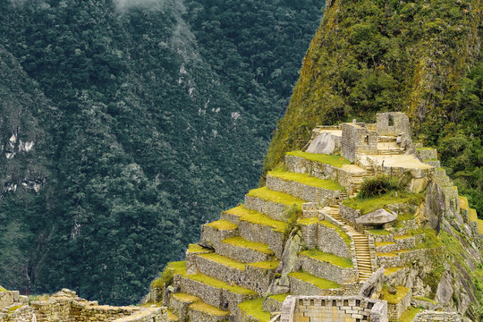 Intihuatana building (sacred place) of Machu Picchu with U&ntilde;a Picchu mountain in the background