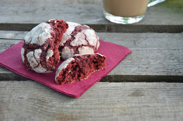 Top view of female using her laptop at a cafe. Overhead shot of young woman sitting at a table with a cup of coffee and mobile phone surfing the net on her laptop computer.