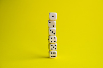 dice on a yellow background