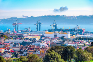 Lisbon skyline, cranes and cargo containers