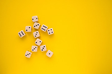 dice on a yellow background in the form of a man