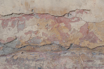 old chipped plaster on the concrete wall, chipped paint, abstract concrete, beige texture, background