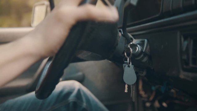 Old car keys hanging in ignition while driving