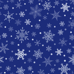 Christmas seamless pattern of snowflakes, white on blue background.