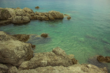 rest concept of  empty blue sea resort waterfront coast district with stones in colorful summer bright day time and nobody else 