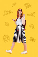 Walking with music. Optimistic emotional traveler smiling and feeling relaxed while listening to music during the walk