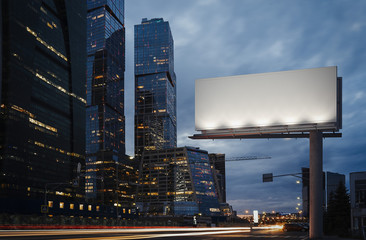 Blank billboard at twilight next to skyscrapers. 3d rendering
