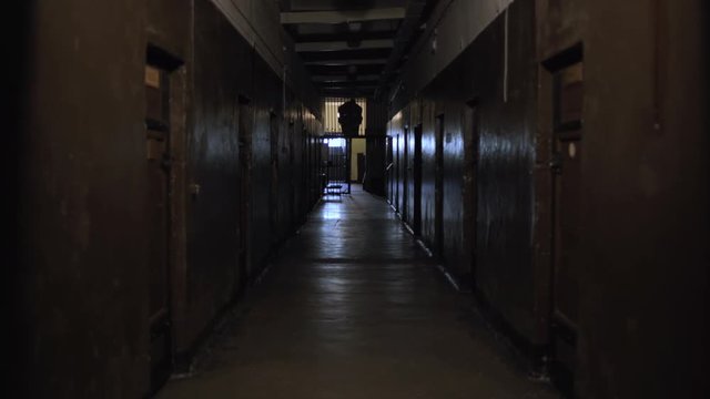 Abandoned Soviet and Nazi prison cell hallway in Karosta