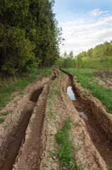 Dirt road with deep rut