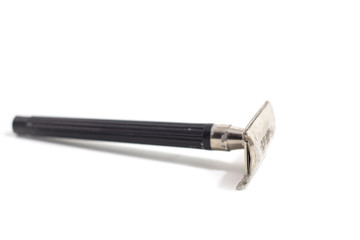 Used razor, white background, single blade