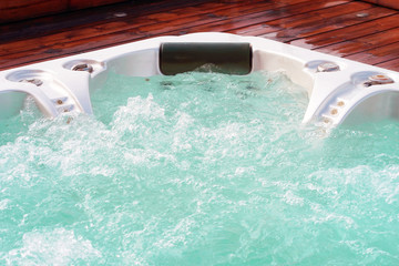 Hotel staff worker cleaning the pool. Pool cleaner during his work. - obrazy, fototapety, plakaty