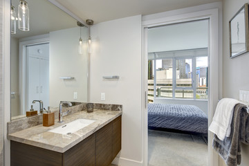 Fototapeta na wymiar Luxury stylish condo bathroom design with marble vanity cabinet.