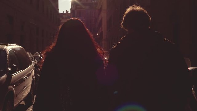 young couple walks through the city at sunset.Romance, relaxation, walk-back vie
