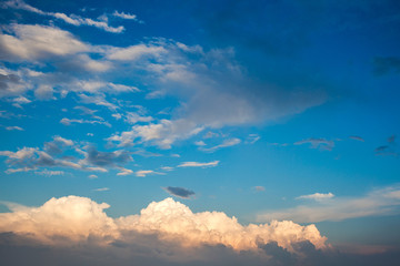 Clouds.Great cloud.The sun on the clouds.Screensaver on your desktop.Dawn.The sky is blue